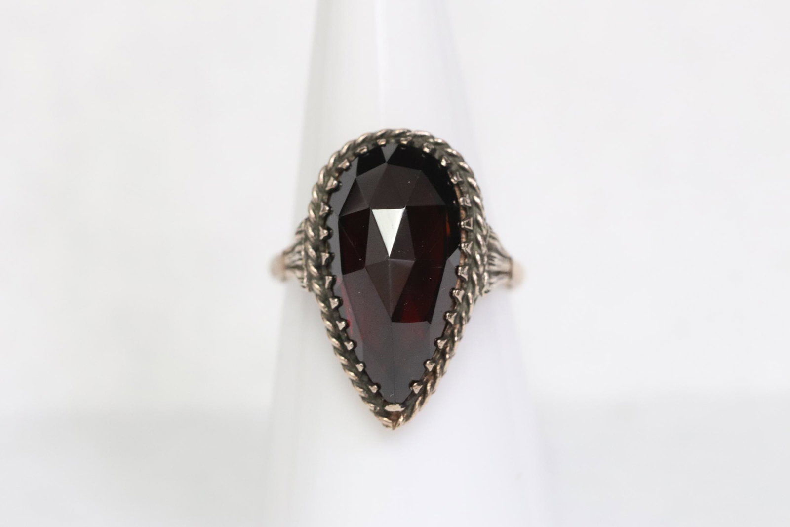 14K rose gold garnet ring: 14K rose gold ring, center a pearl shape garnet, wt. 5.8gm, size 6.5