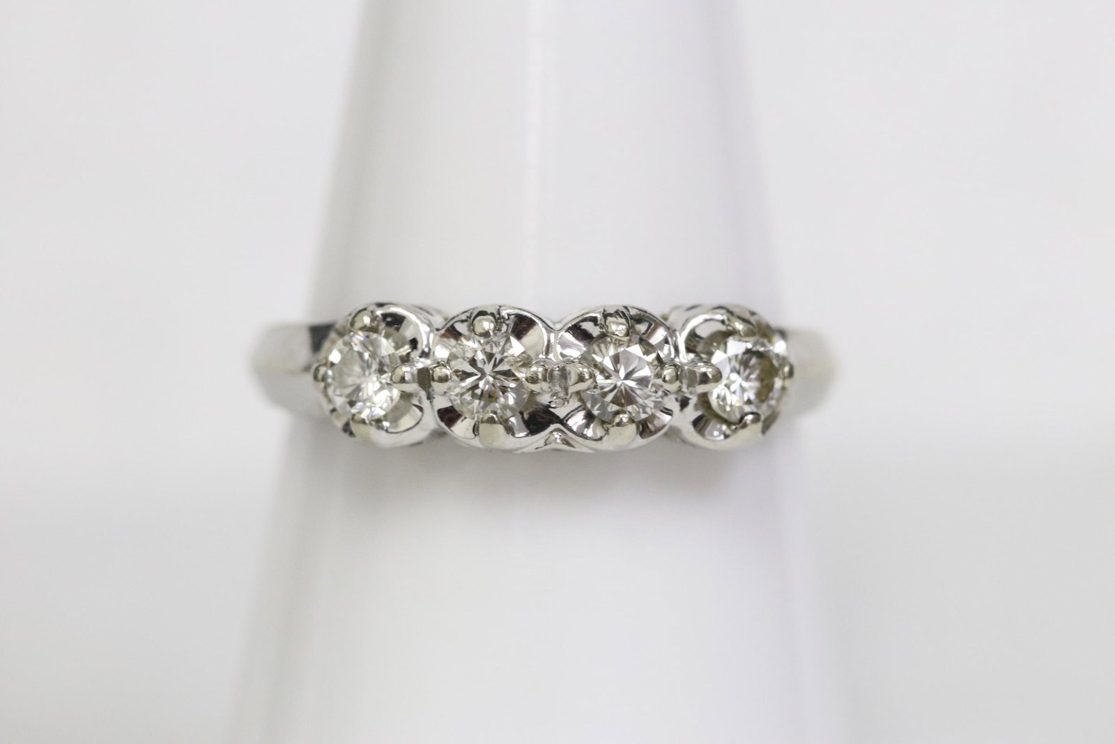 14K W/G diamond ring: 14K W/G diamond ring set with 4 excellent quality brilliant cut diamonds, tdw approx. 0.40ct, wt. 2.4gm, size 6.5