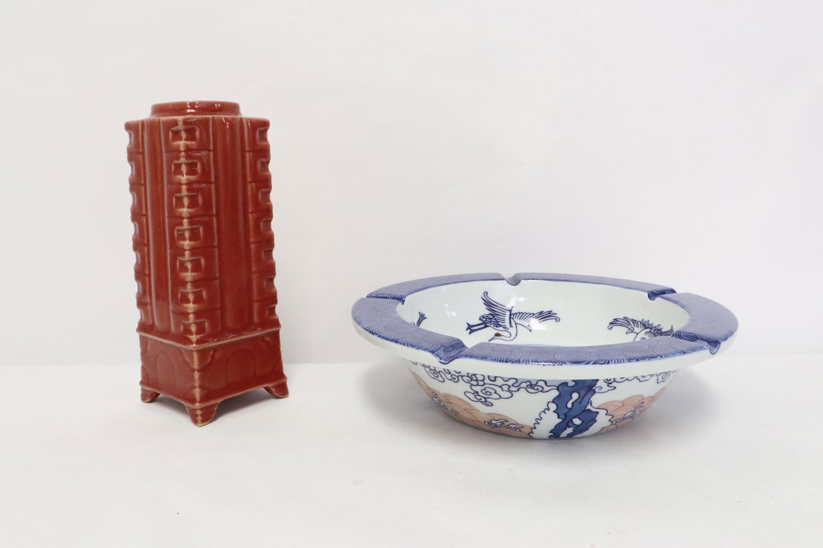 a blue, red and white ash tray and a porcelain vase (1 of 11)