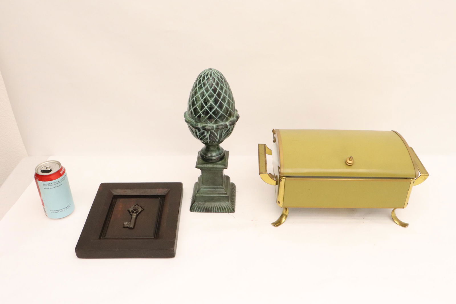 art deco warmer, bronze obelisk, & a framed key: 3 pieces; art deco warmer, bronze obelisk, and a framed key