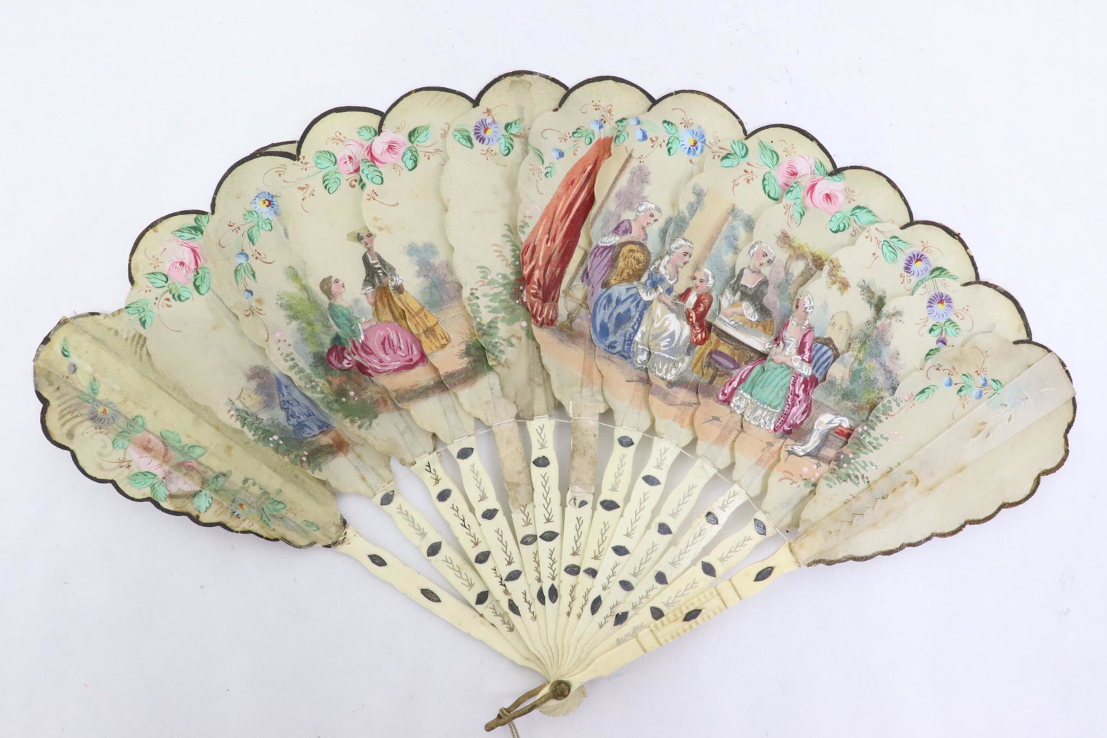 Antique carved bone framed fan with silk panel: Antique carved bone framed fan with silk panel painted with court scene, 9.5"L