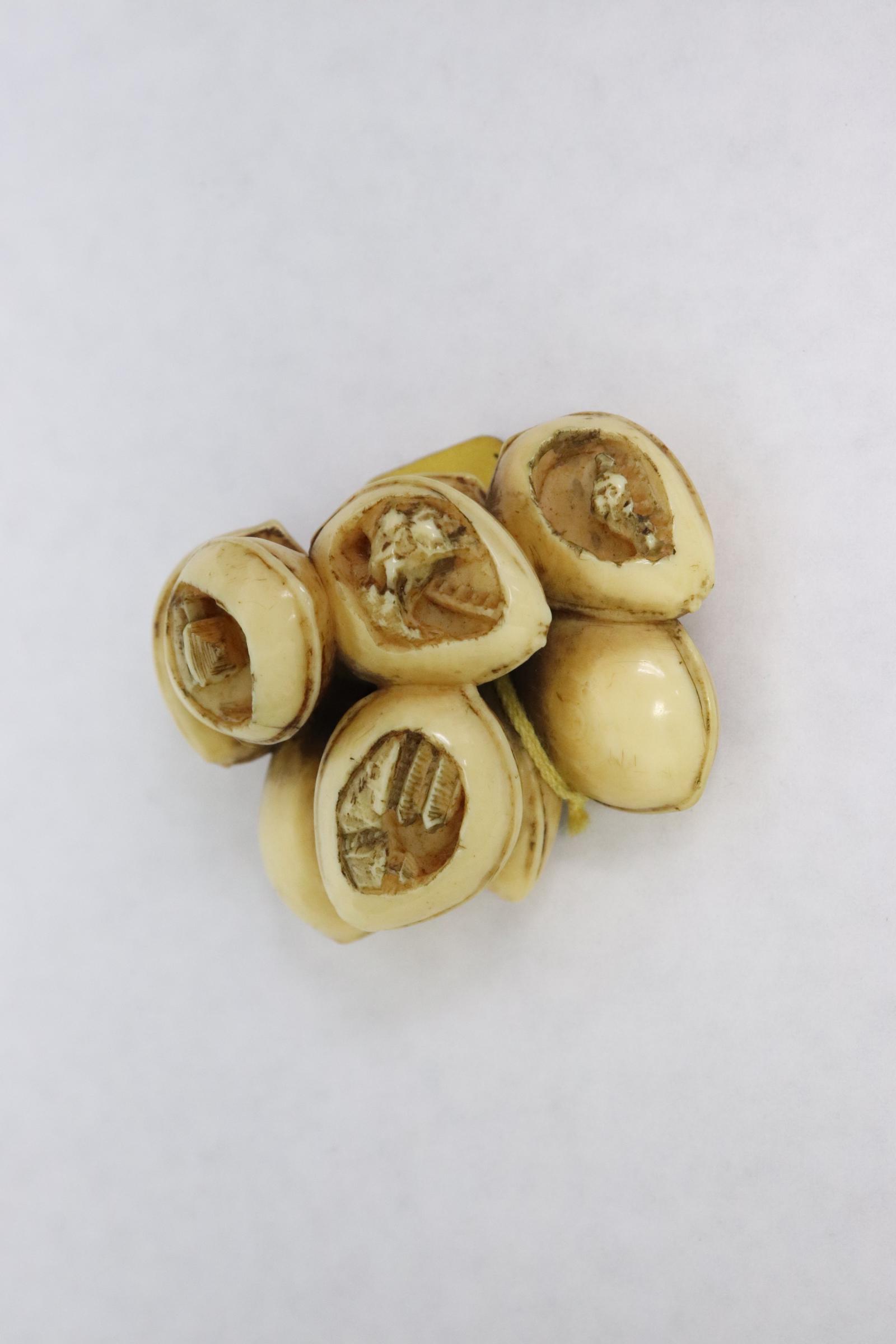 Antique Japanese bone carved netsuke by Kageyoshi: Antique Japanese bone carved netsuke "views of lake Biwa" by Kageyoshi, 1"Hx2.8"x1.3"