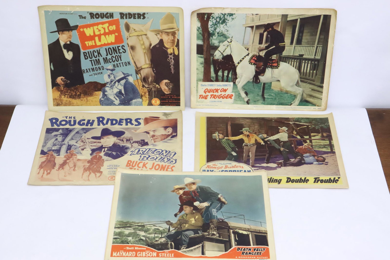 5 vintage movie lobby cards: 5 vintage movie lobby cards; "quick on the trigger", "Death Valley rangers", "the rough rider", "what of the law", and "traveling double trouble"