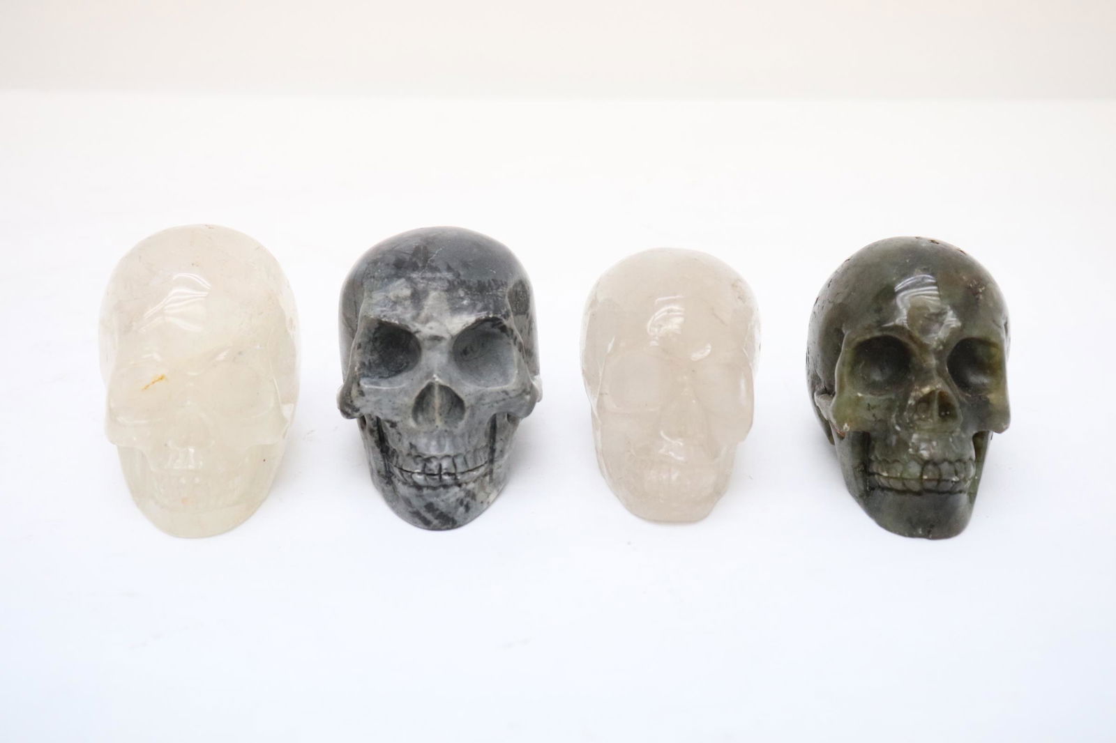 4 natural stone carved skulls (1 of 10)