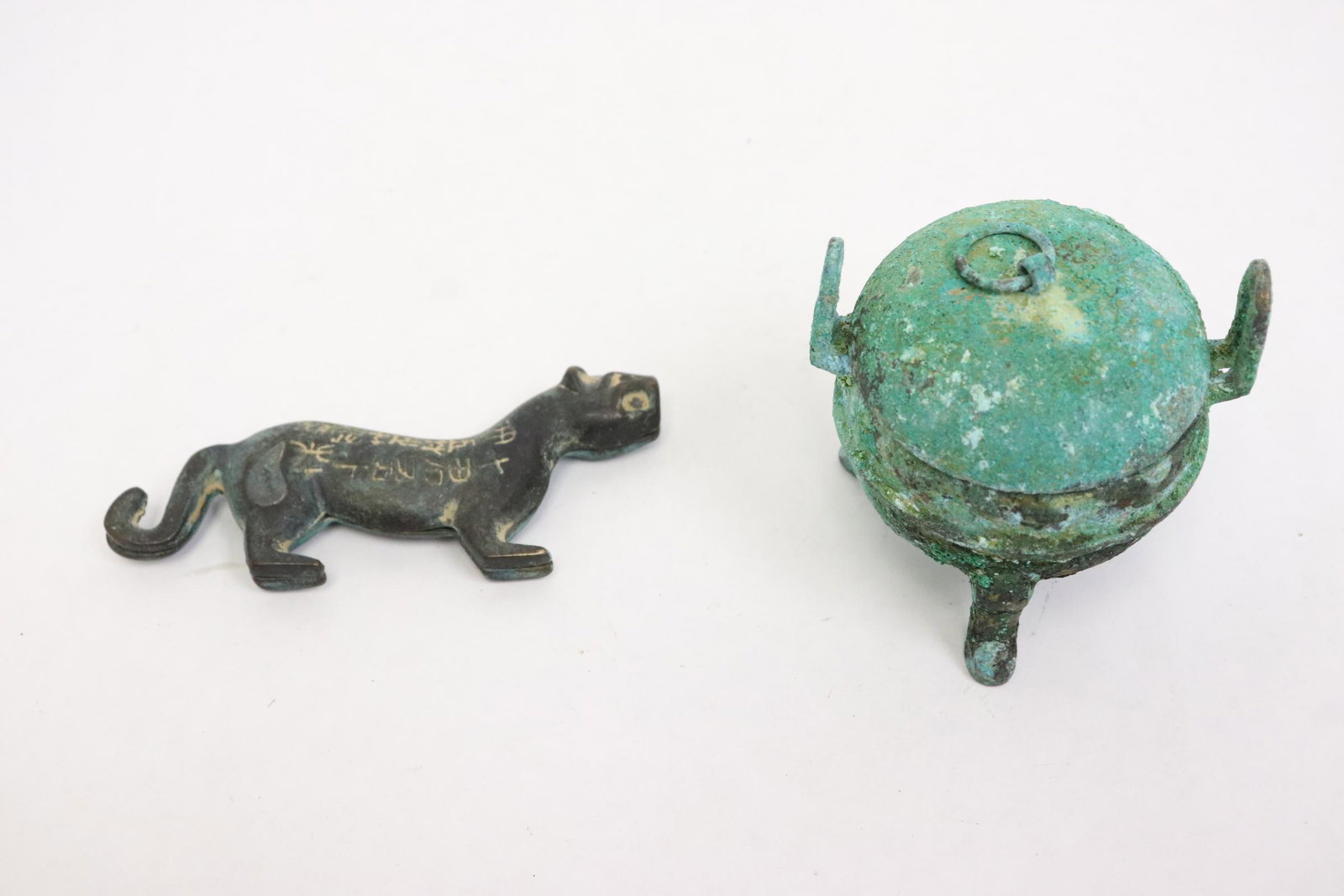 A small bronze covered censer and a bronze tiger (1 of 9)