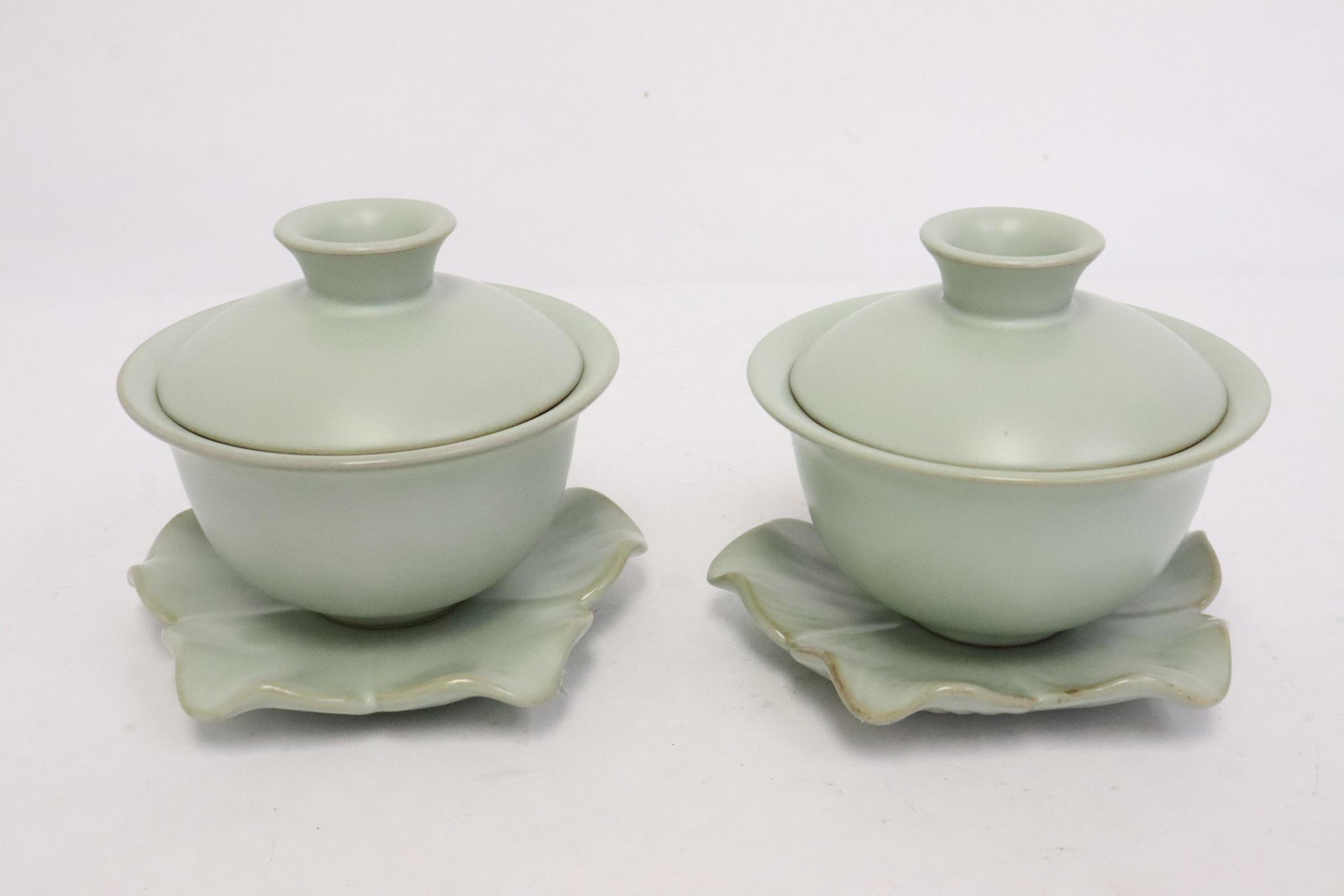 Pair celadon covered tea cups with stand (1 of 10)