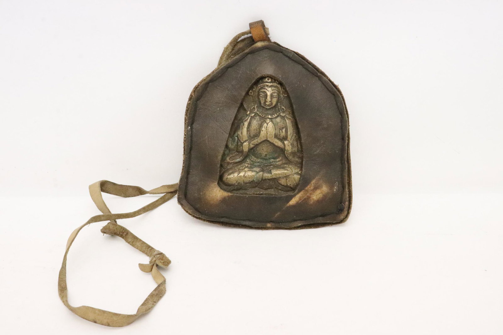 Tibetan bronze religious ornament in leather pouch (1 of 9)