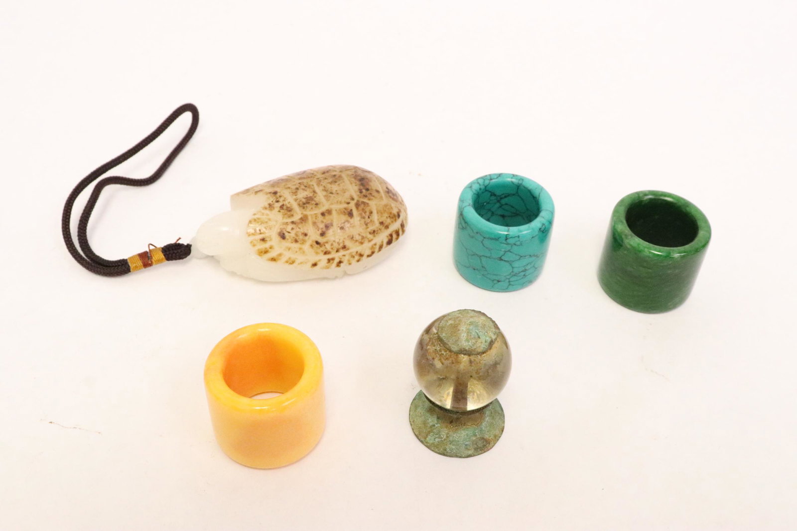 3 archer's rings, a hat finial, & a Peking glass turtle (1 of 11)