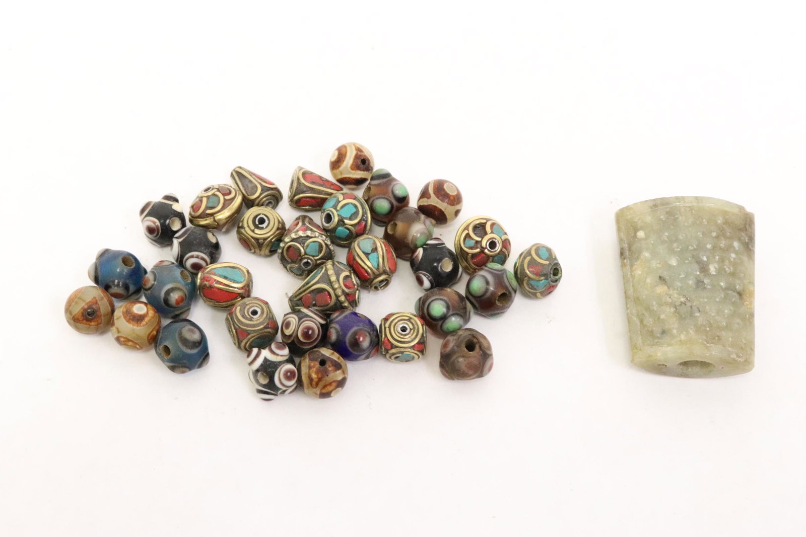 Lot of beads, and a jade like stone ornament (1 of 10)