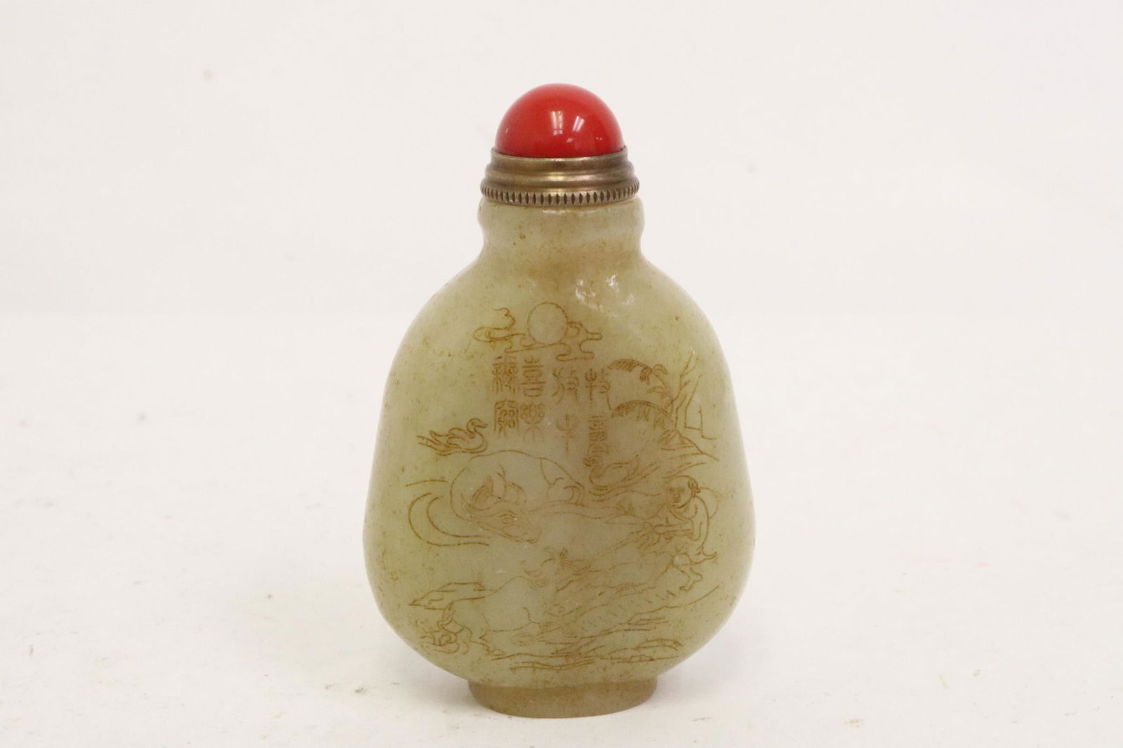 Light celadon jade carved snuff bottle (1 of 9)