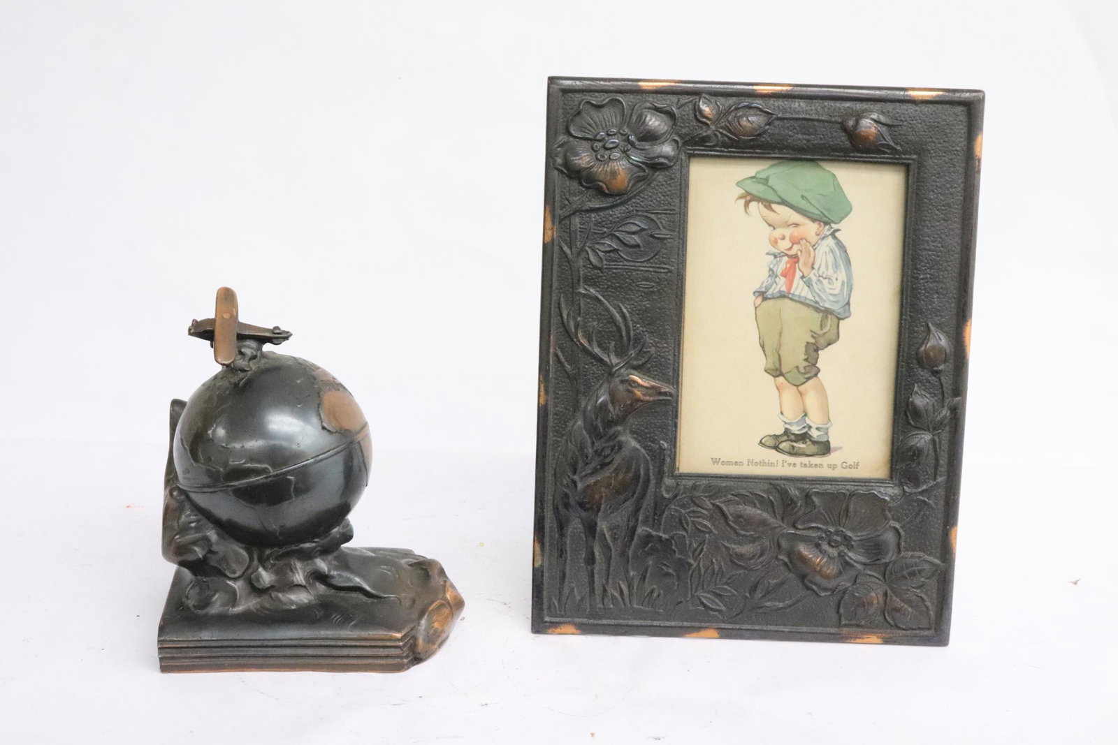 A bookend and a vintage cast iron picture frame: A single bookend (5.7"x4.8"x3.3") and a vintage cast iron picture frame (9.1"x6.9")
