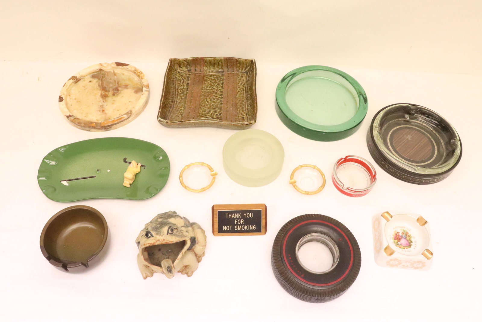 Large lot of ash trays: Large lot of ash trays; including a memorabilia example from Firestone Tire (1.8"Hx6.3"dia)