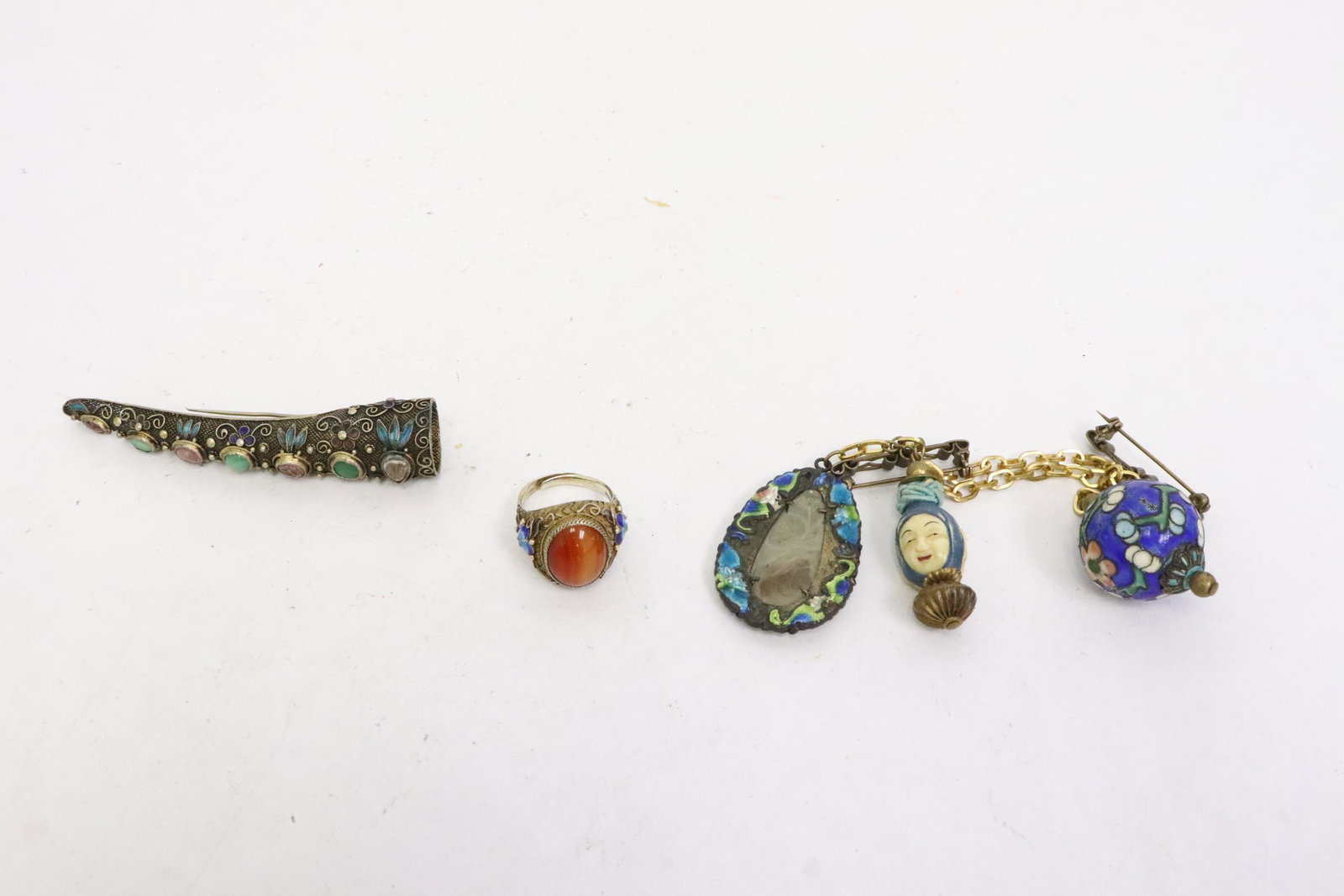 3 pieces: 3 pieces; antique silver finger (3.5"L) with jadeite and tourmaline, enamel ring (size 8.3) with carnelian, and an antique coat charm brooch with 3 charms (1.55"L - 1.75"L)