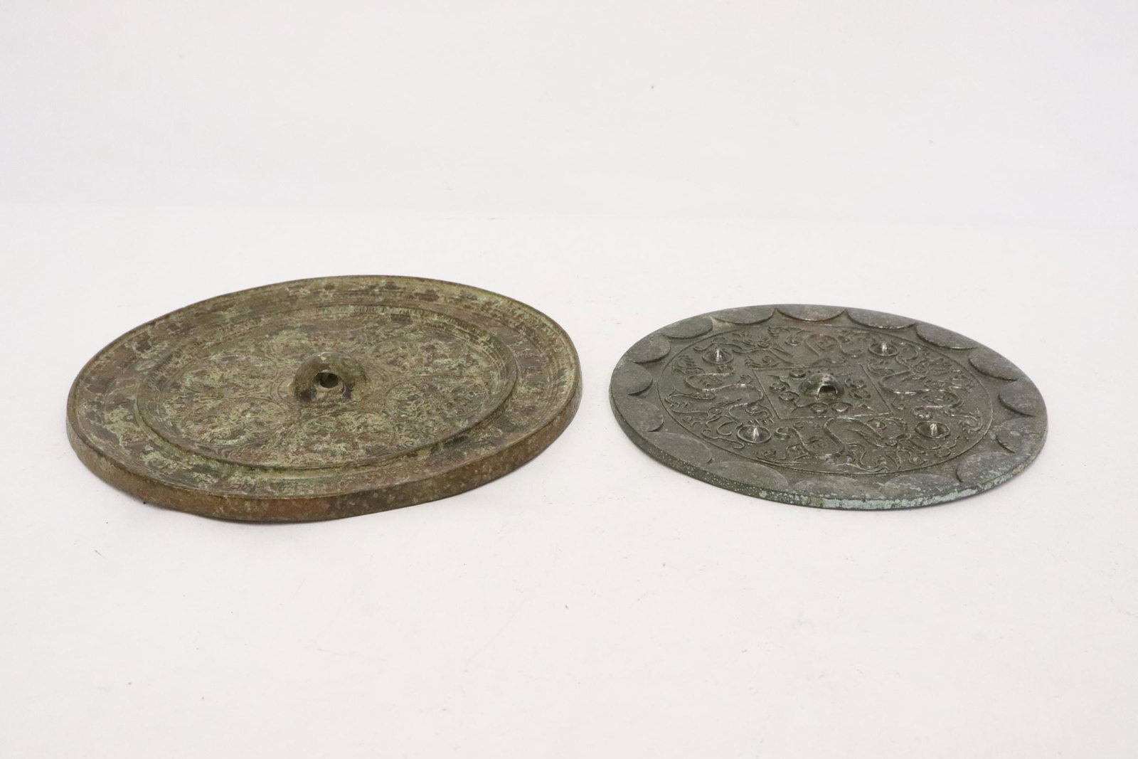 2 Chinese bronze mirrors: 2 Chinese bronze mirrors, 0.3"x5.4"dia, 0.6"x6.4"dia
