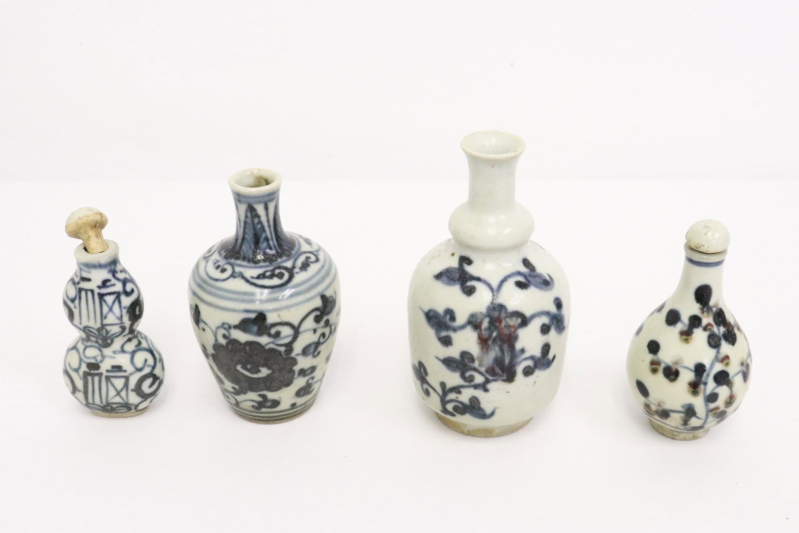 4 Chinese blue and white porcelain snuff bottles: 4 Chinese blue and white porcelain snuff bottles, 2.9"x1.4"x0.8" - 4"x2.2"dia