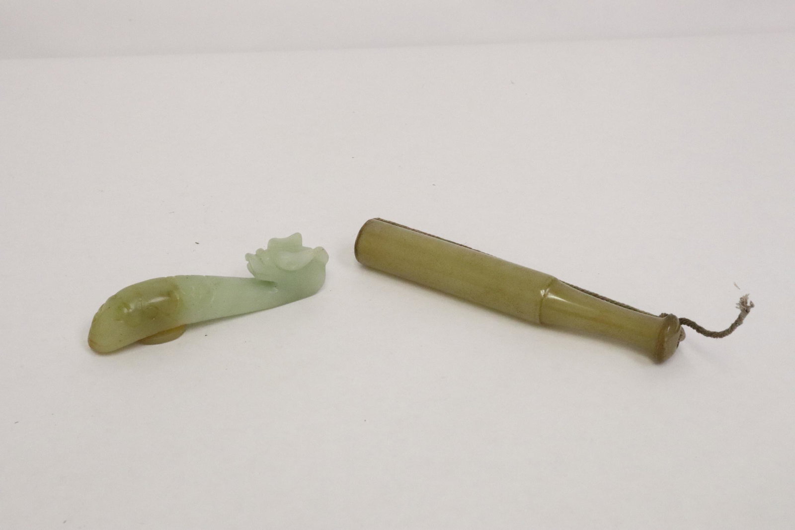 celadon jade belt buckle & a carved cigarette holder (1 of 9)