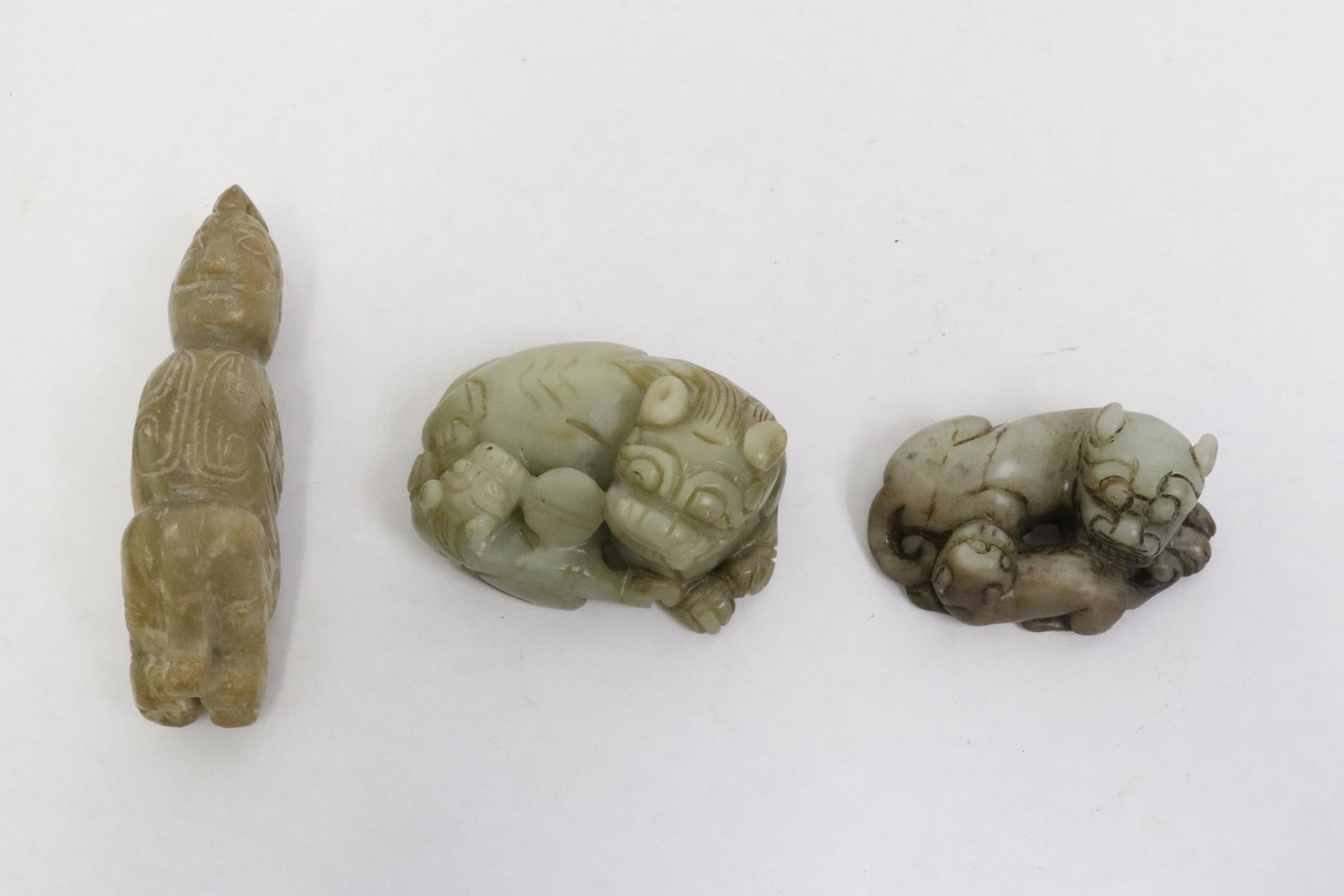 3 celadon jade carvings; 2 qilin and one figure (1 of 11)