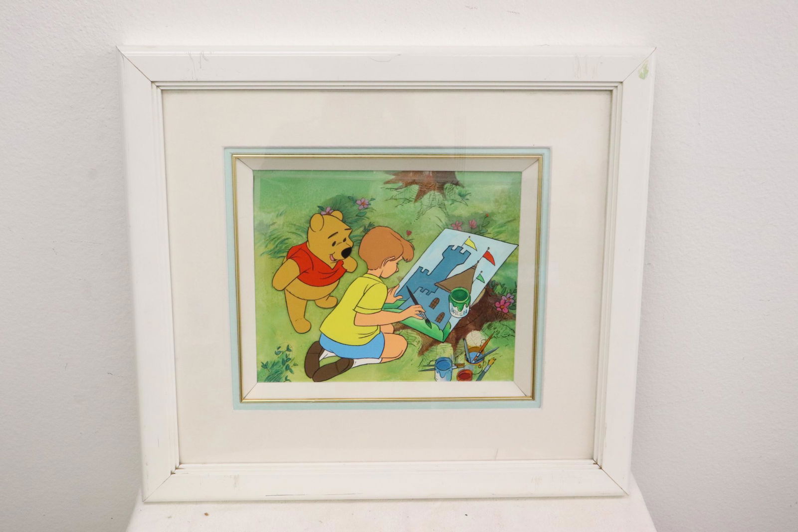 A framed production cel with background (1 of 6)