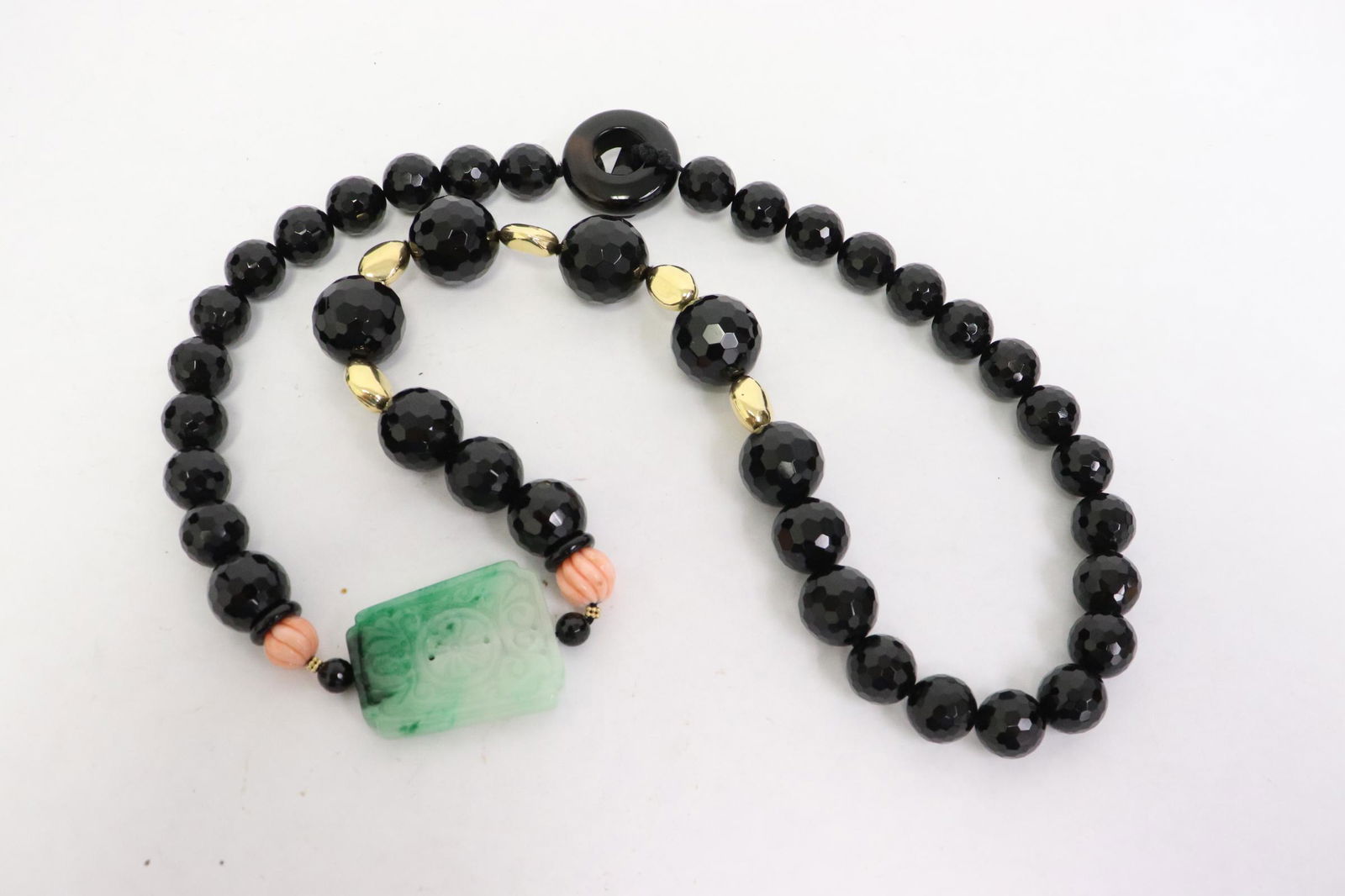 A jadeite, coral, onyx and 18K Y/G bead necklace (1 of 11)