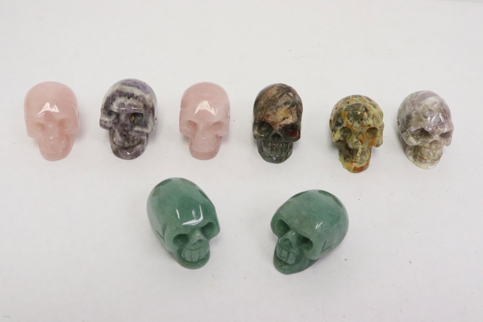 8 stone carved skulls: 8 stone carved skulls, 1.5"x2"x1.3"