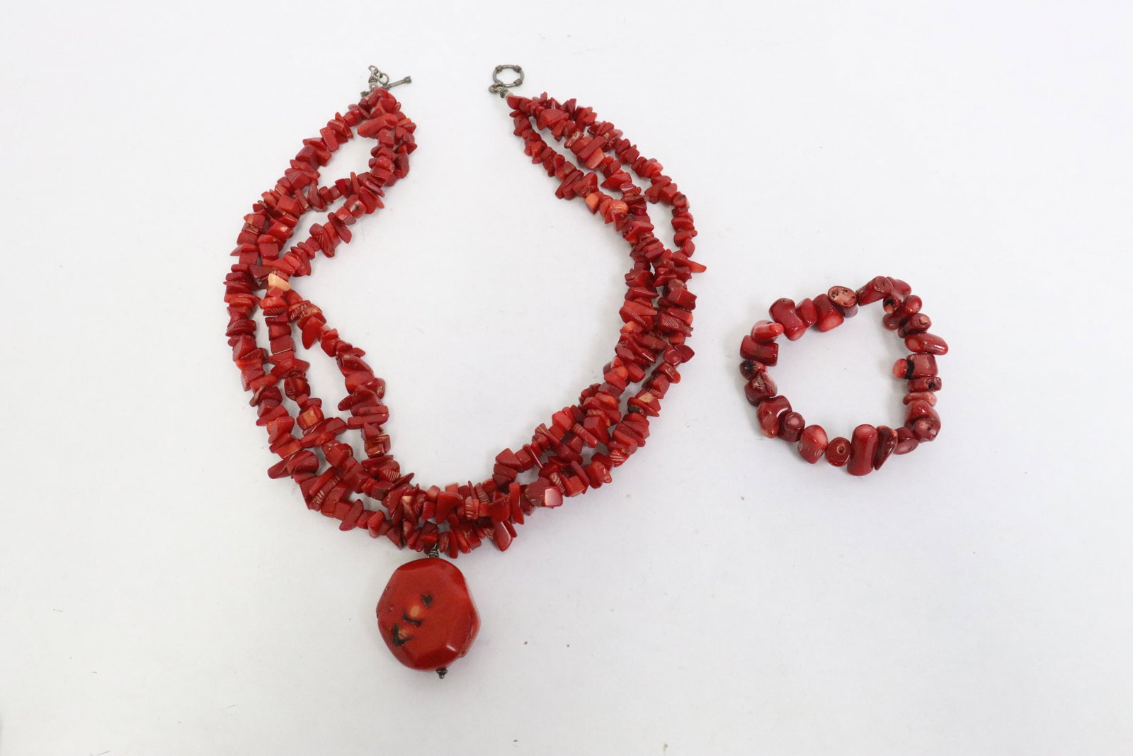 A coral bead necklace, and a coral bead bracelet: A coral bead necklace with silver clasp, and a coral bead bracelet, NO INTERNATIONAL SHIPPING OF CORAL