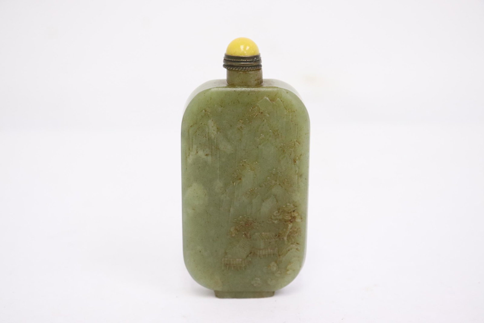 A celadon jade carved snuff bottle: A celadon jade carved snuff bottle, 3.25"x1.5"x0.6"