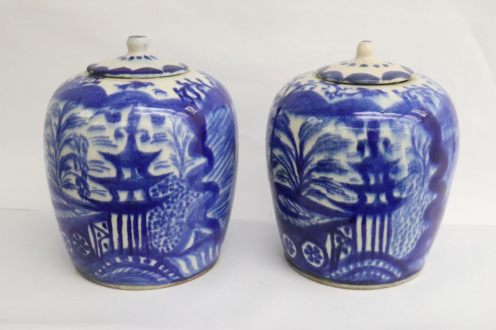 Pair Chinese vintage blue and white covered jar: Pair Chinese vintage blue and white covered jar, base minor chip, also inside cover minor chips, 10.3"x8.2"dia