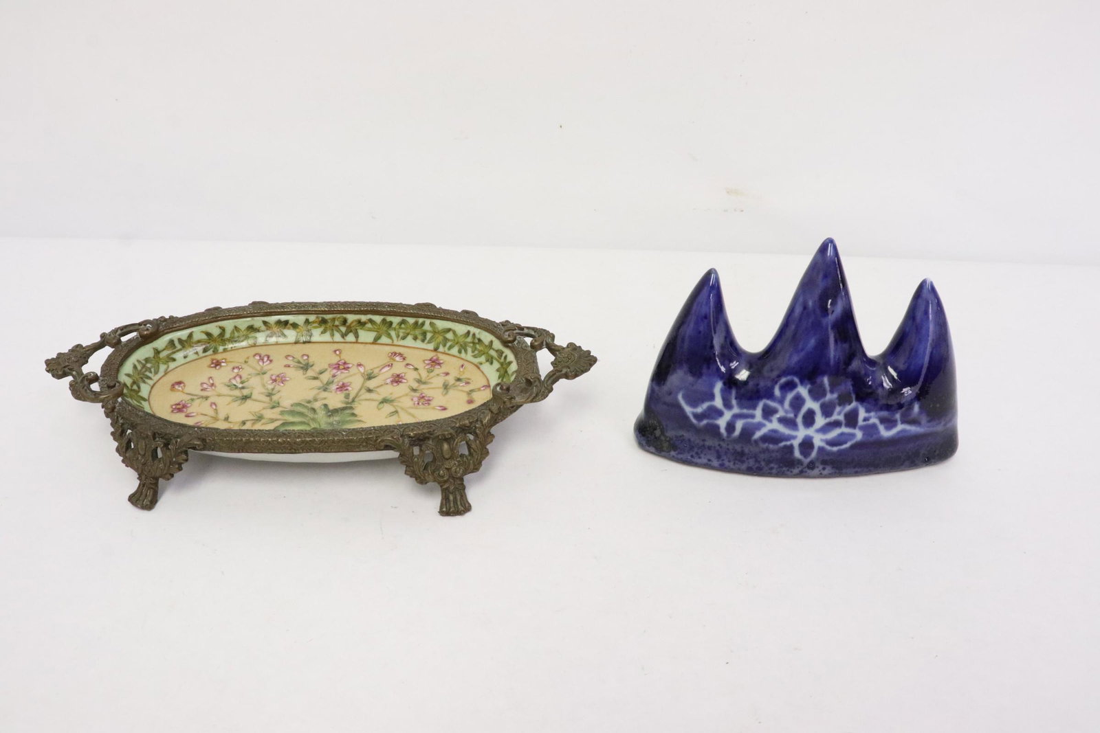 A porcelain brush mountain, & a famille rose plate: A blue porcelain brush mountain (3.3"x4.8"x1.3"), and a famille rose plate with bronze mount (1.25"x8"x4")