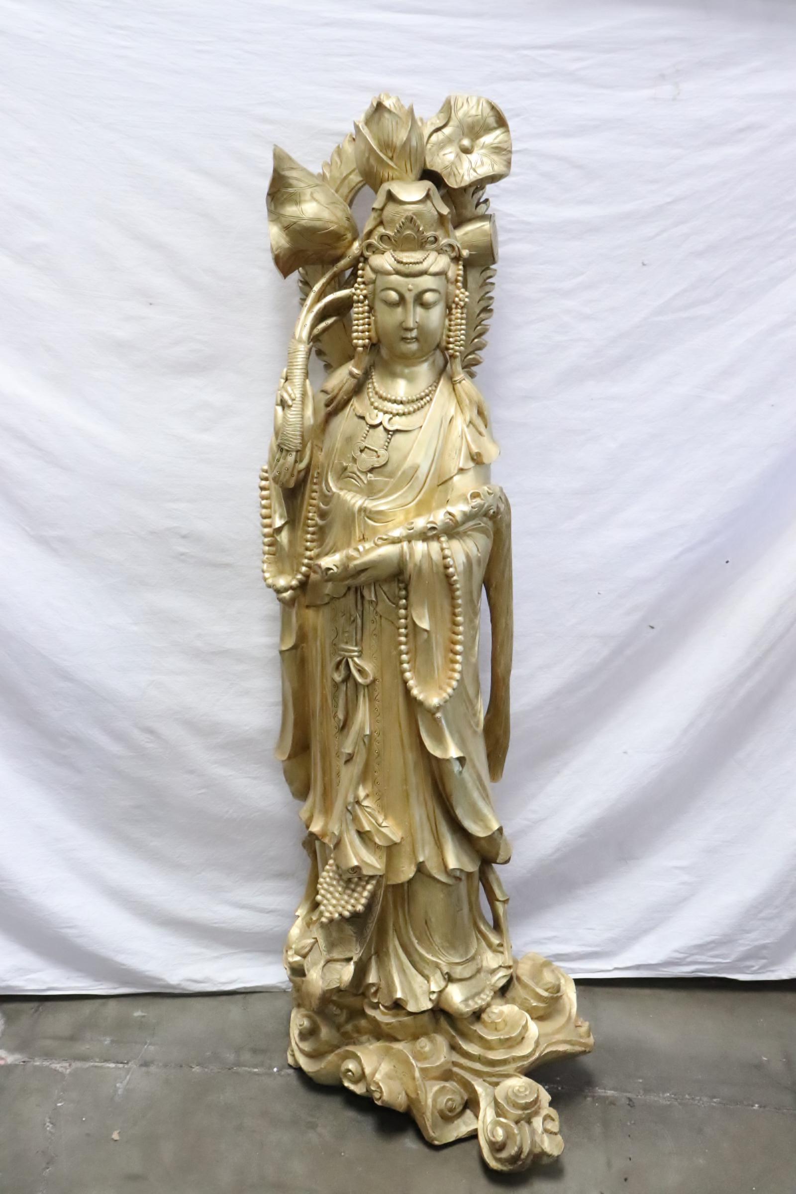 A massive Chinese carved & gilt wood Guanyin: A massive Chinese carved and gilt wood Guanyin, 57.5"H