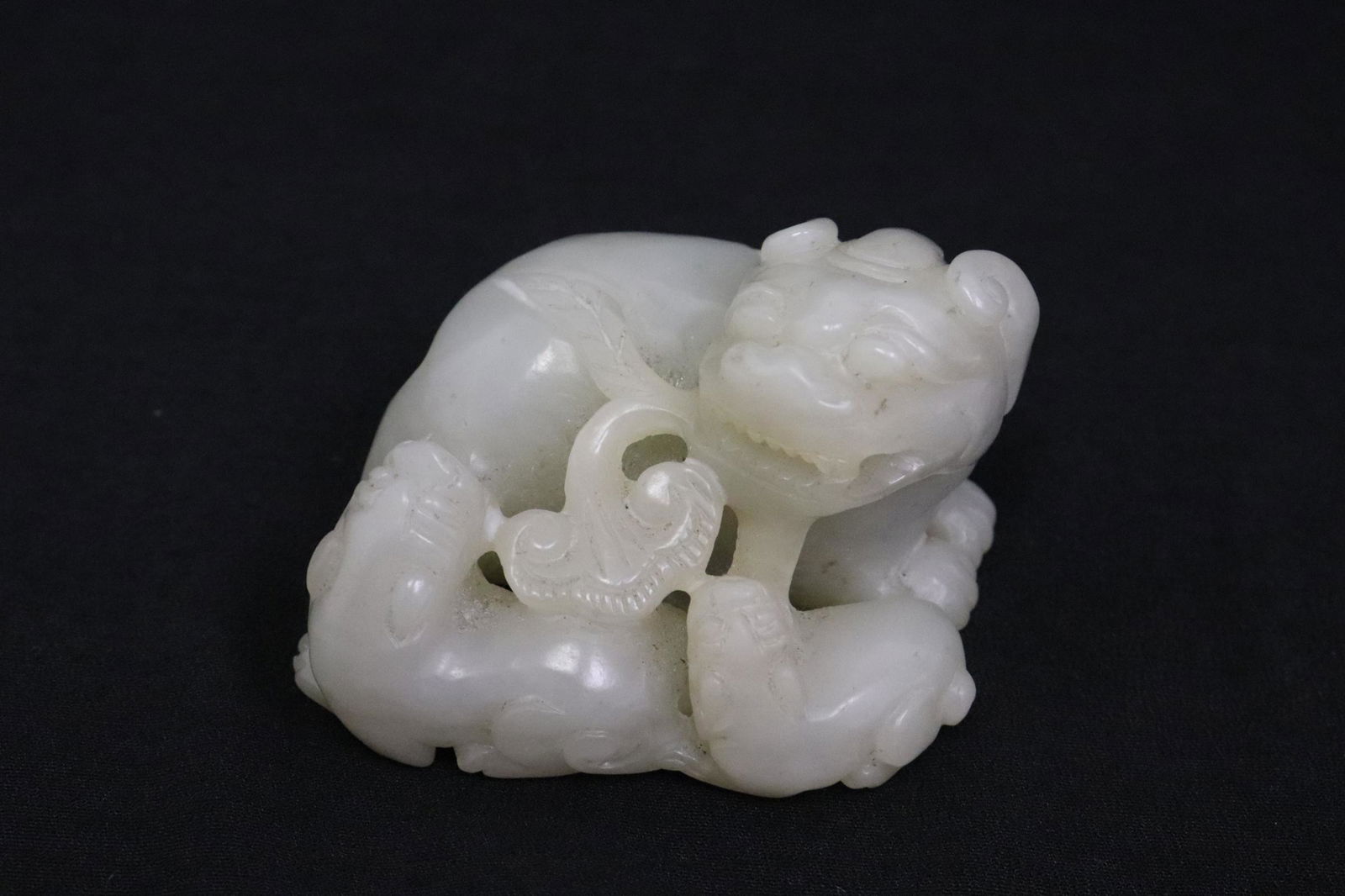 A beautiful light celadon jade carved qilin group (1 of 10)