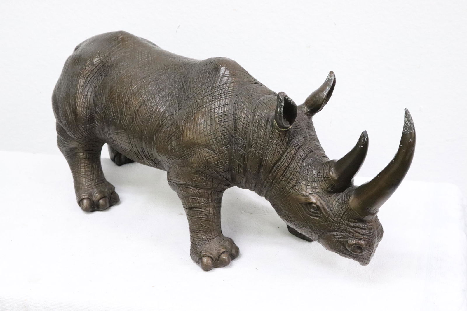 A painted resin sculpture of rhino (1 of 8)