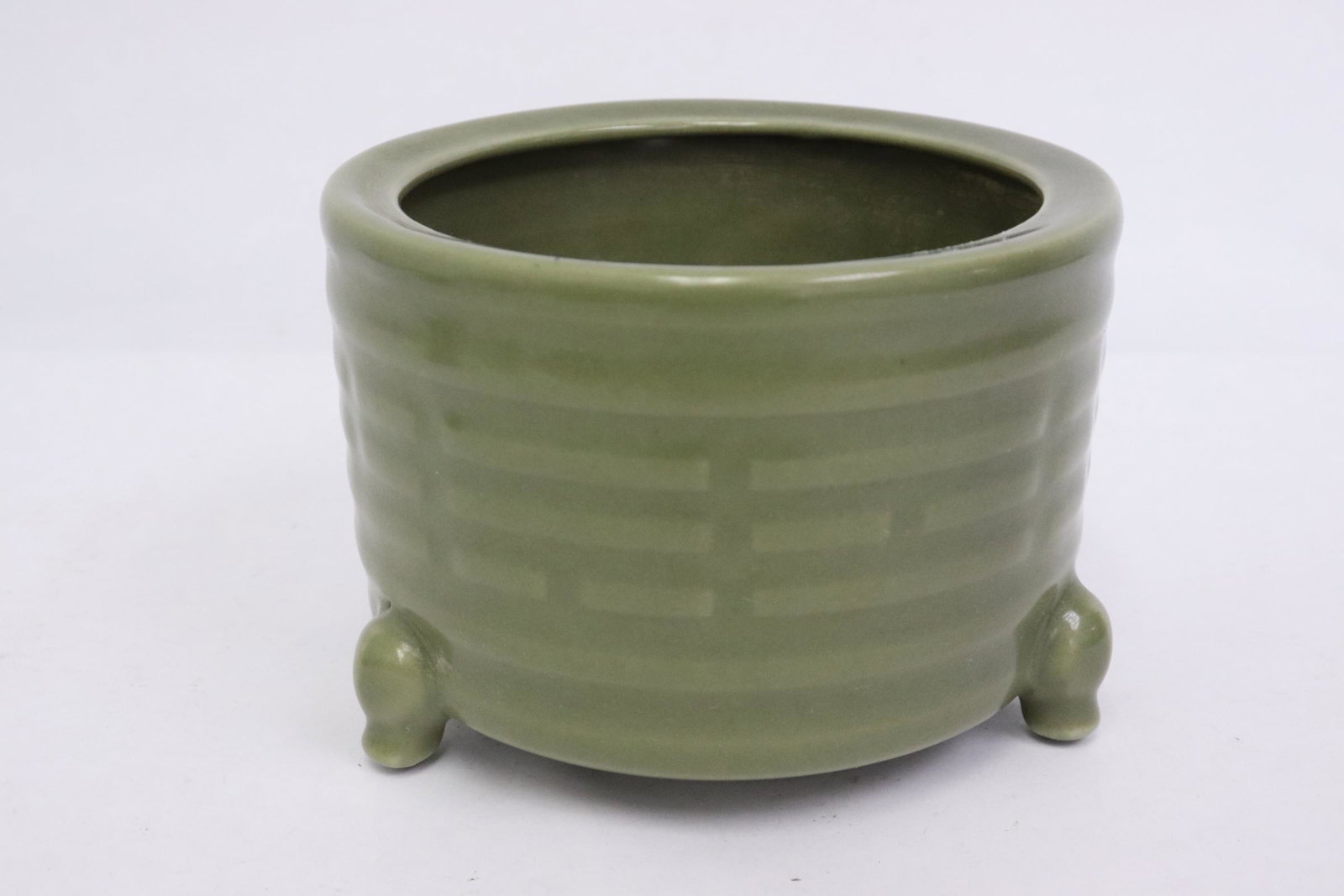 A celadon tripod censer: A celadon tripod censer, 3.7"x5.1"dia