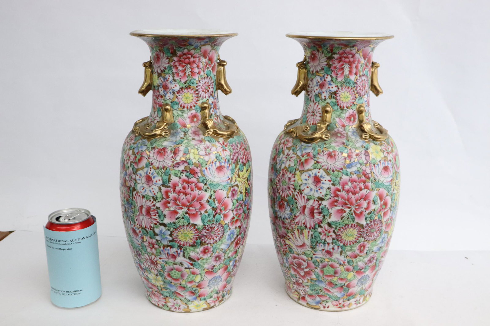 Pair Chinese famille rose porcelain vases: Pair Chinese famille rose porcelain vases, one has crack and repair, 14"x7"dia