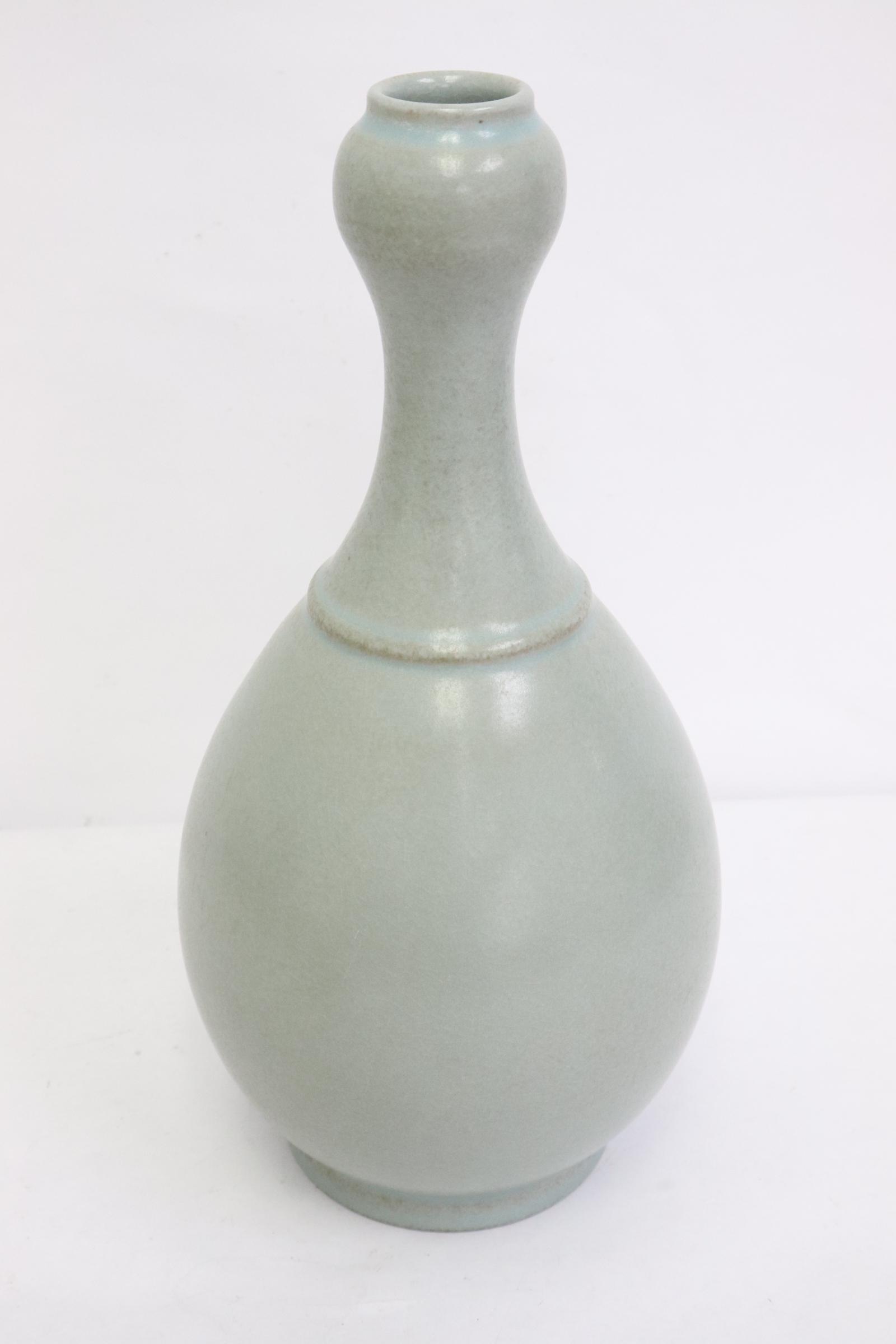 A light celadon porcelain garlic top vase: A light celadon porcelain garlic top vase, 10.6"x5.25"dia