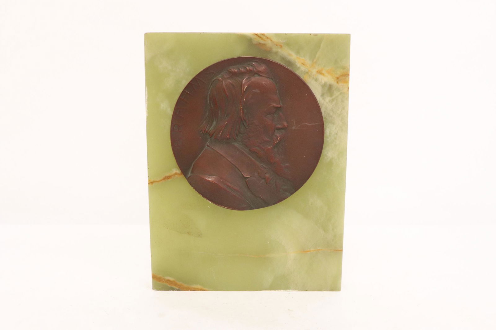 A bronze medallion mounted on onyx plaque (1 of 8)