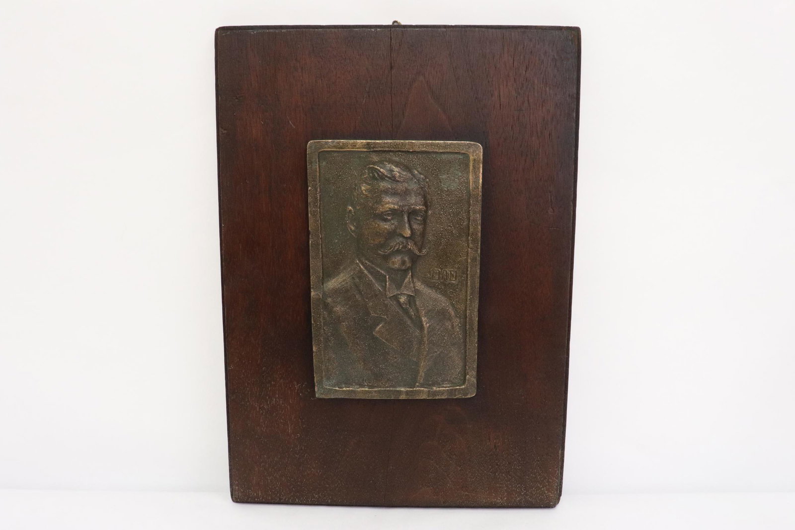 A bronze plaque mounted on wood plaque (1 of 8)