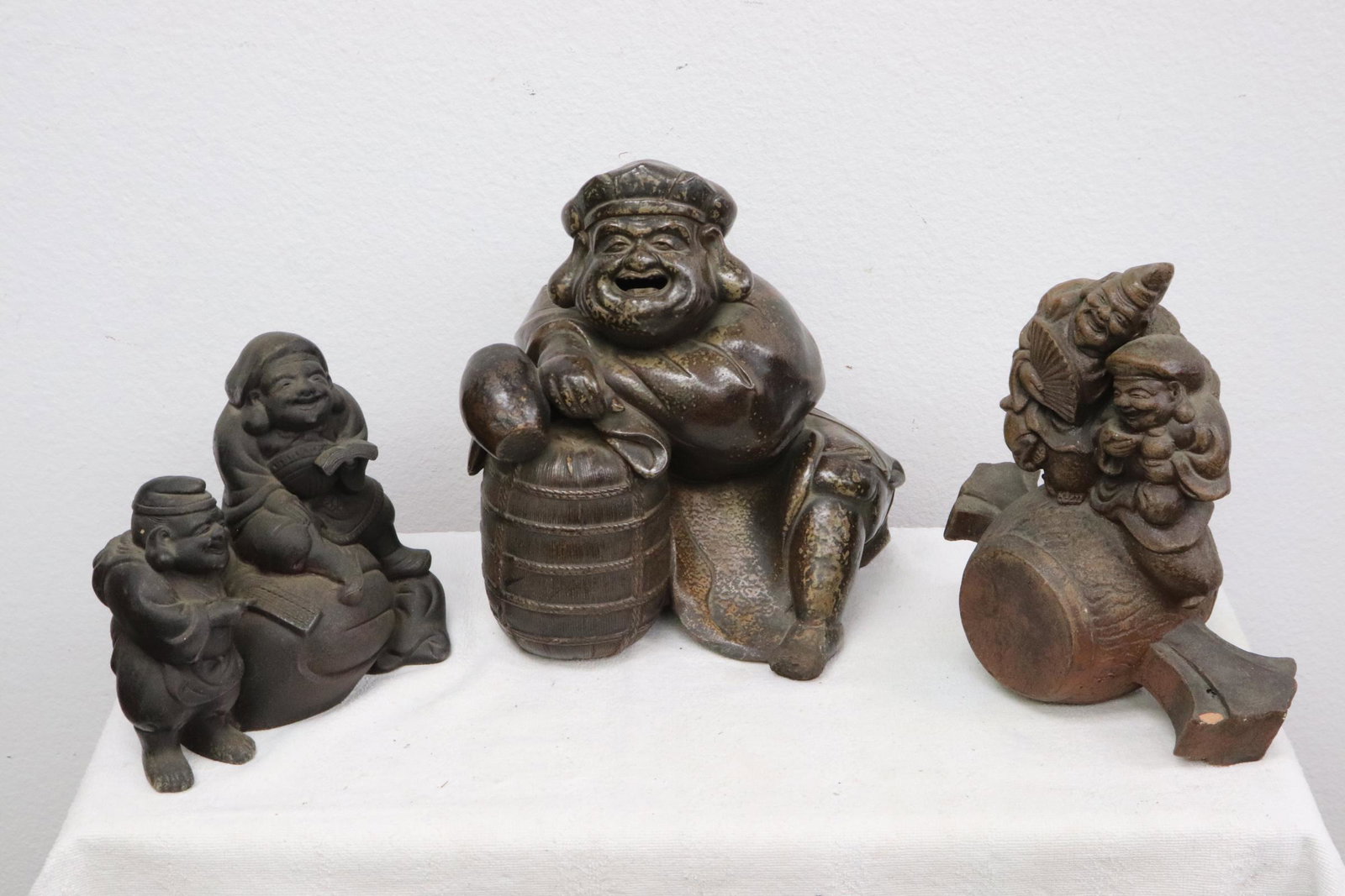 3 large antique Japanese earthenware deities: 3 large antique Japanese earthenware deities, one has small chip, 7.1"H - 10.5"H