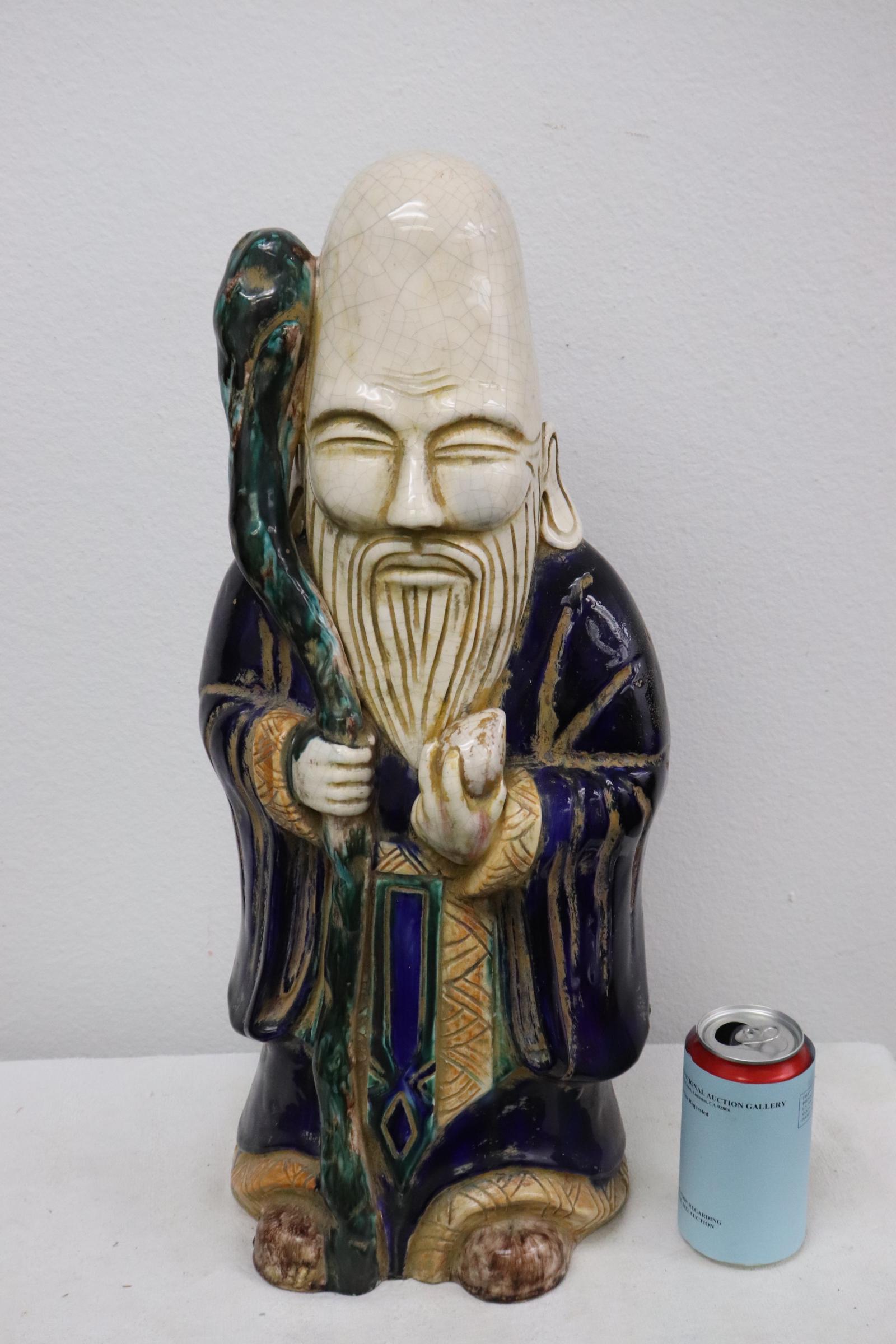 Large Chinese painted earthenware sculpture: Large Chinese painted earthenware sculpture of deity, 22"H