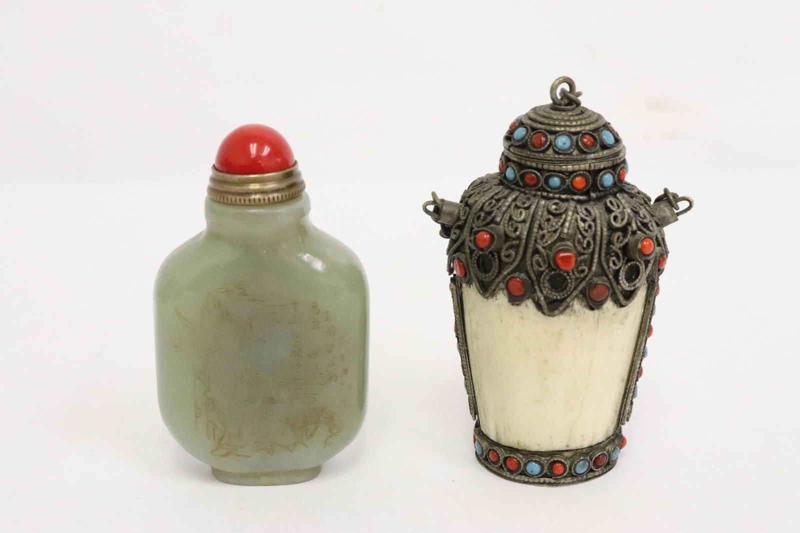 2 snuff bottles: 2 snuff bottles; a celadon jade snuff bottle (2.6"x1.5"x0.7"), and a bone carved snuff bottle (2.9"x1.9"x1.6")