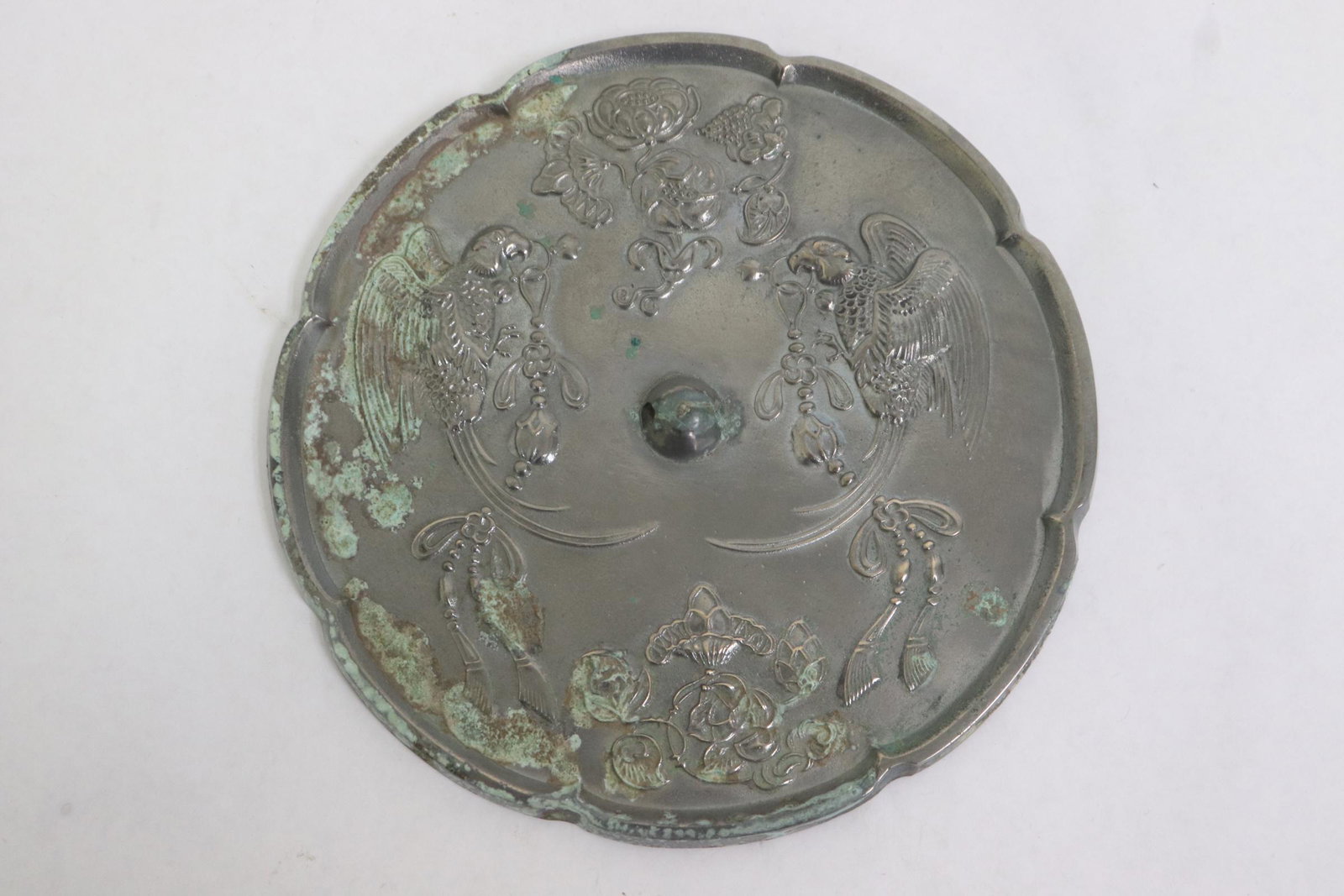 A bronze large mirror: A bronze large mirror, 0.5"x7.25"dia