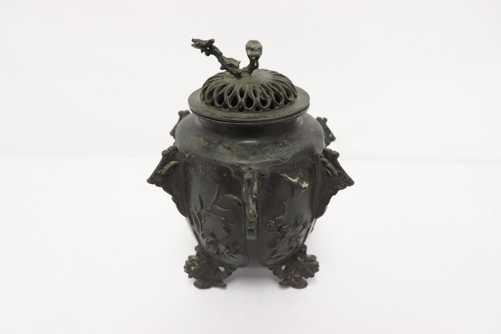 Chinese antique bronze covered censer: Fine Chinese antique bronze covered censer, panel decorated with birds and flowers scene in relief, the leg in phoenix motif, 8"x5.7"x5.7"