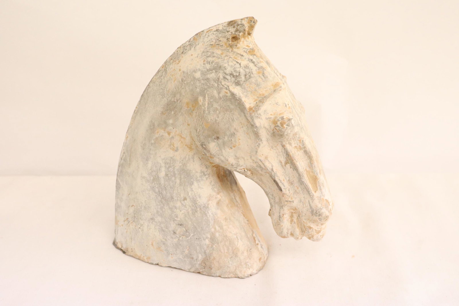 A vintage Chinese earthenware sculpture: A vintage Chinese earthenware sculpture of horse head, 7.85"H