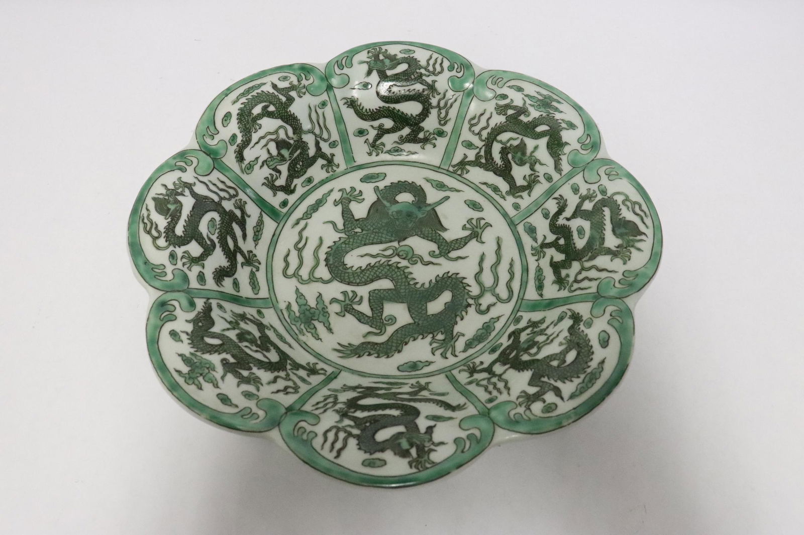 Chinese green on white porcelain plate: Chinese green on white porcelain plate with foliate edge, 2.6"x10.3"dia