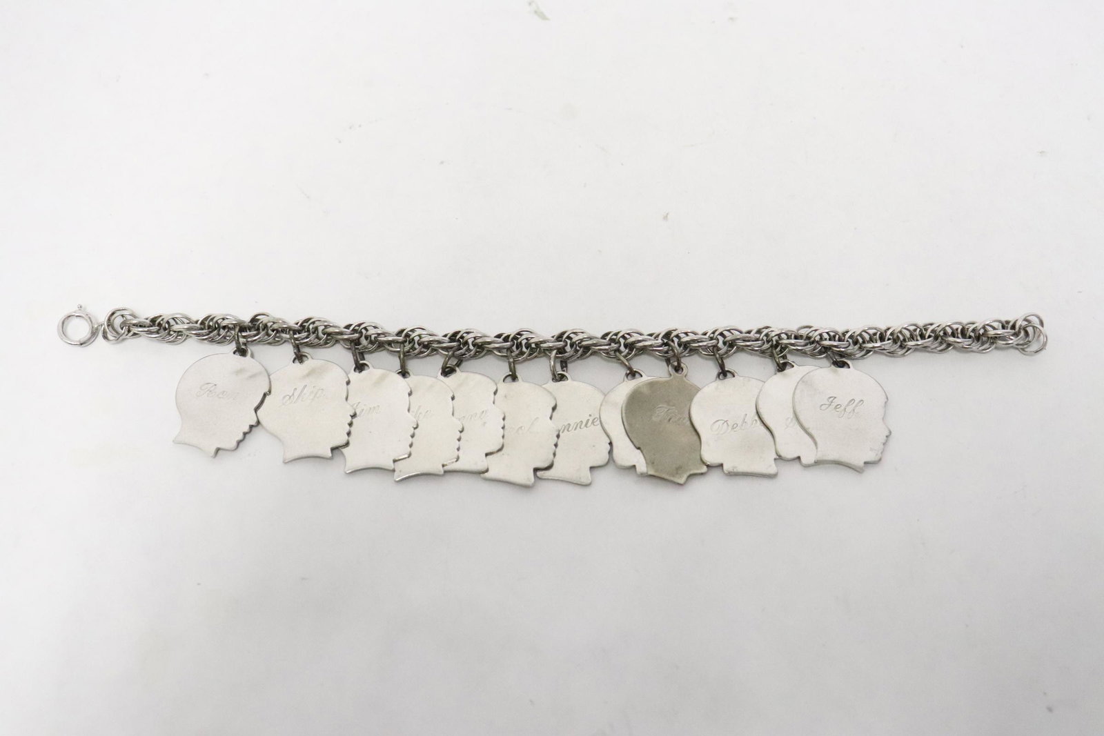 Unusual sterling charm bracelet w/ name plaque: Unusual sterling charm bracelet (7.85"L) with name plaque, wt.