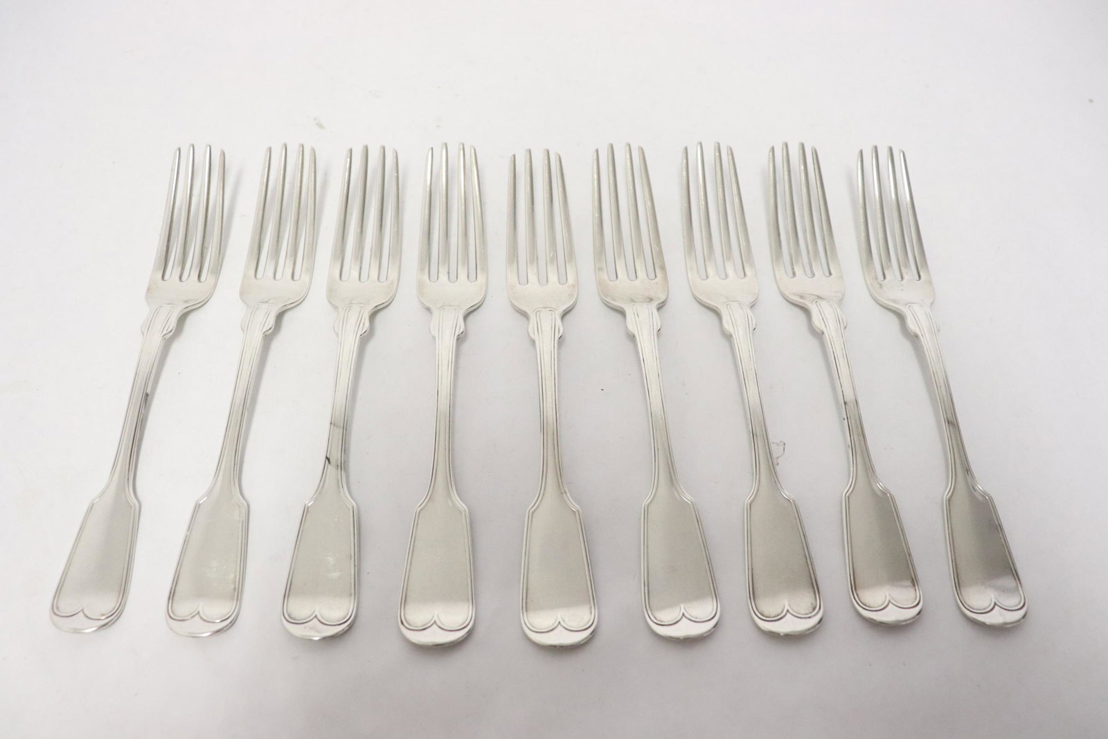 9 coin silver forks by Mulford and Wedell, c1850: 9 coin silver lunch forks by Mulford and Wedell, c1850, wt. 390gm, provenance: estate of Baroness Margaret Von Soosten, 6.6"L each