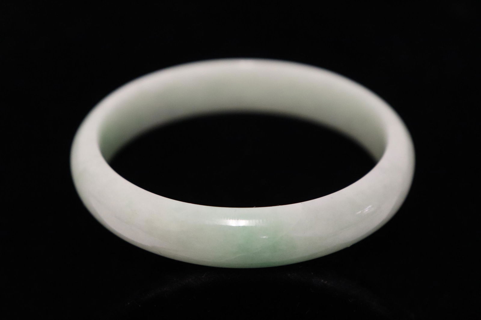 A natural color light apple green jadeite bangle (1 of 7)