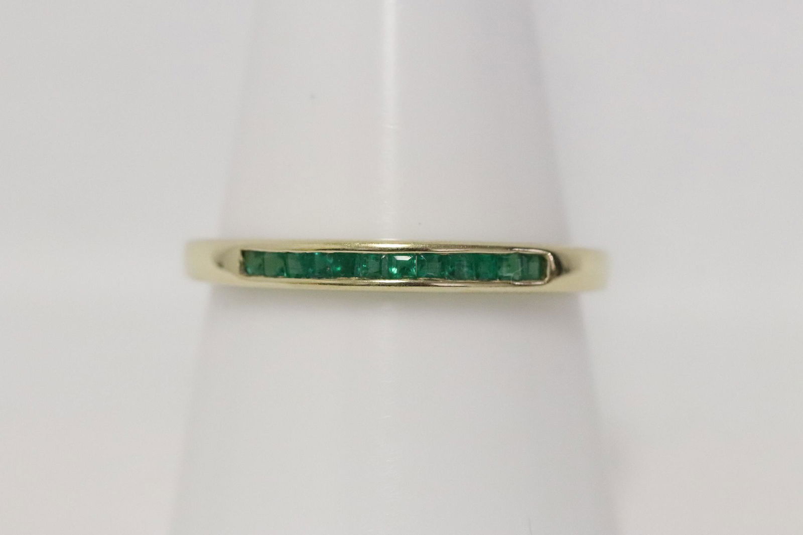 A 14K Y/G band ring, chanel set with emeralds (1 of 9)