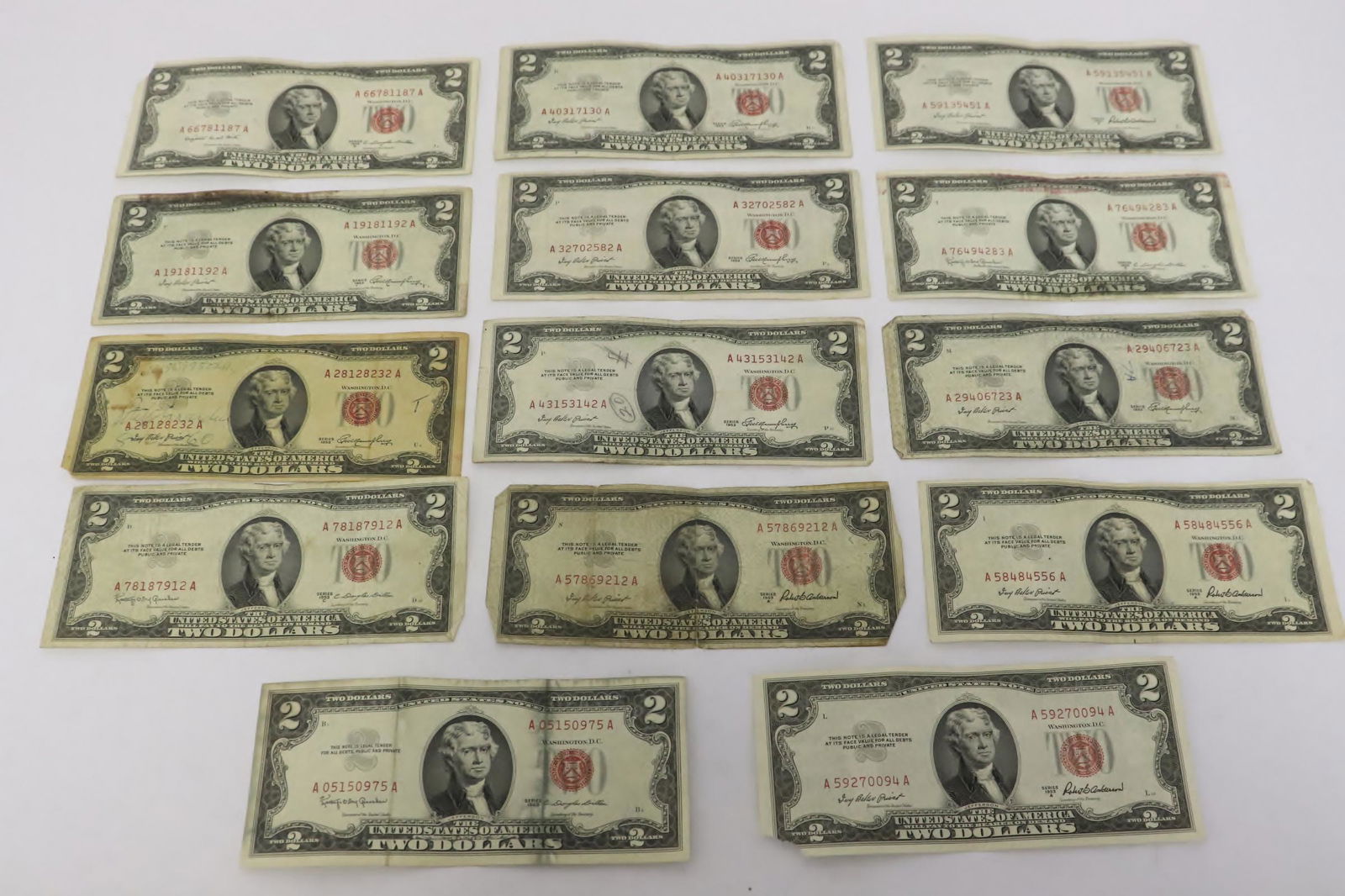 Thirteen 1953 red seal US $2 bills (1 of 10)