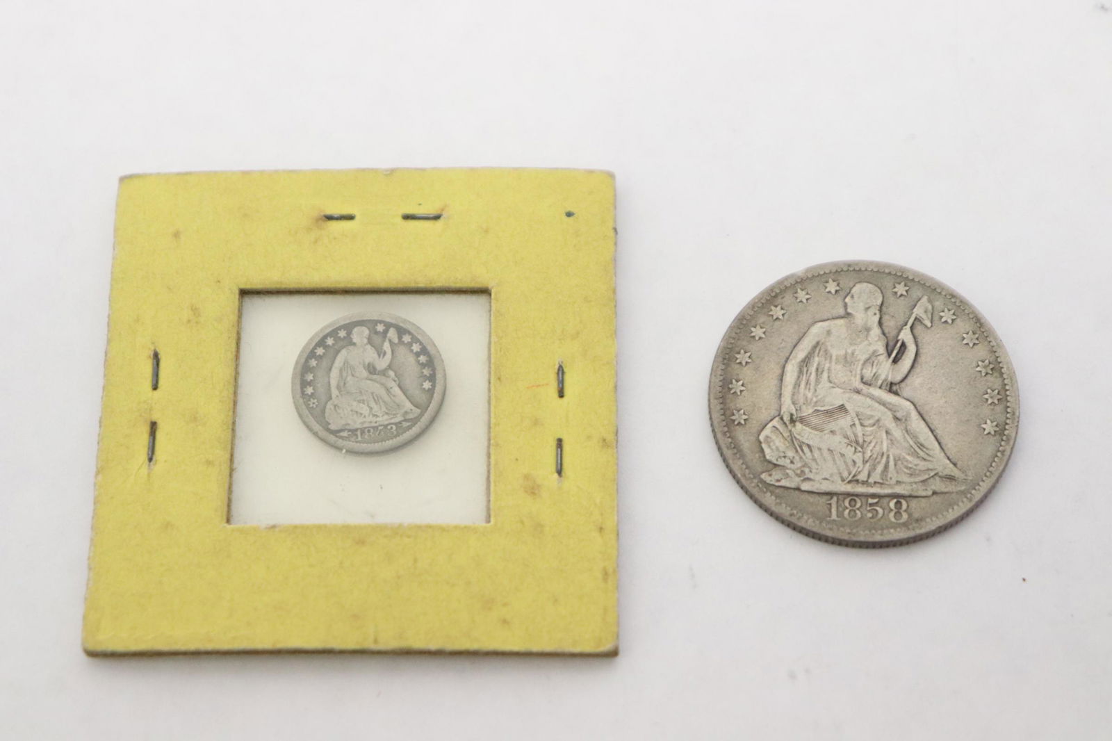 A US silver half dollar and a silver half dime (1 of 7)