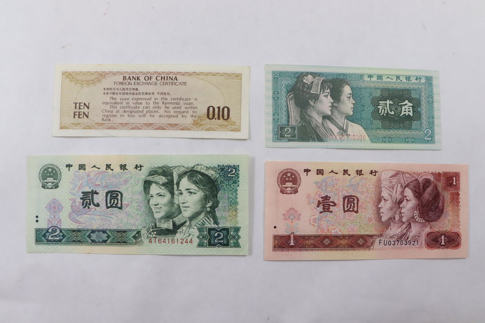 3 Chinese 1980 bank notes, & a1979 certificate (1 of 9)